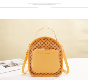 Detail view of mustard yellow vintage mini backpack with round geometric patterns