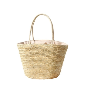 Large straw tote bag with embroidered lemon pattern and sturdy dual handles for beach vacation