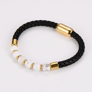 Detail of black braided leather bracelet with magnetic clasp and white marble stone beads