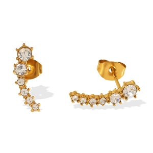 Minimalist gold half moon stud earrings with curved crystal rhinestones on white base