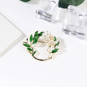 Gardenia flower brooch with green enamel leaves and white pearls on gold-toned metal base