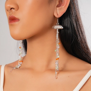 Detail of silver jellyfish tassel earrings with colorful beads and starfish charms