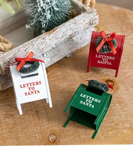 Detail of colorful mini Christmas mailboxes with Letters to Santa text and tiny wreaths