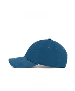 Side view of deep blue cotton baseball cap showing ventilation eyelets and stitched brim