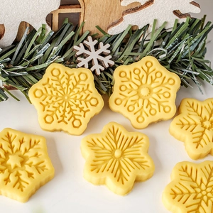 Mini snowflake cookie mold set for Christmas baking with detailed fondant stamps