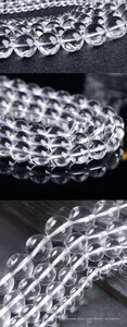 Macro view of transparent natural white crystal round beads with high clarity and polish