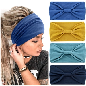 Detail of soft knotted elastic sports headbands in blue, yellow, and cyan colors