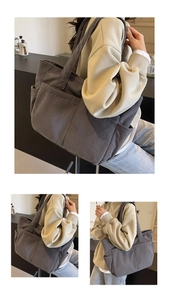 Détail du sac cabas en velours côtelé gris foncé montrant la texture et la poche latérale