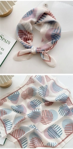 Detail of a square chiffon neck scarf featuring pastel geometric patterns and prints