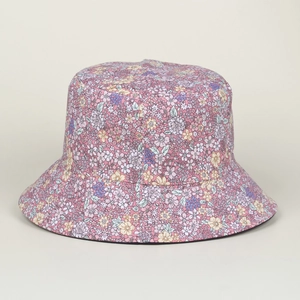 Close-up of floral print bucket hat fabric detail with pink and purple flower pattern