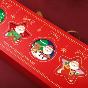 Festive red Christmas gift box with golden handles and Santa reindeer cutout design