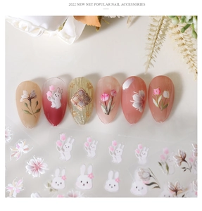Close-up of 5D embossed nail stickers with tulip and bunny patterns on gradient nails