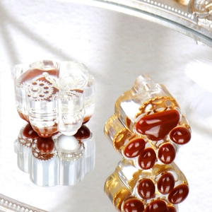 Detail of cat paw resin molds featuring steampunk gears and realistic paw pads