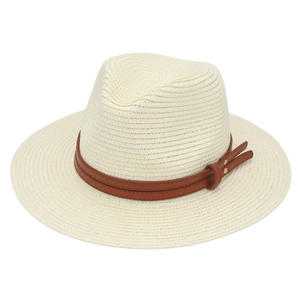Close-up of beige Panama hat with brown faux leather band and metallic buckle detail