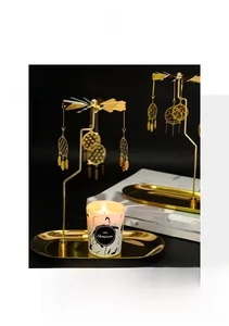 Macro detail of golden heat-powered carousel with dreamcatcher charms and tray
