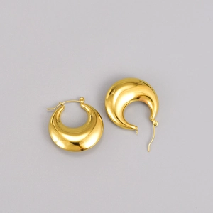 Boucles d'oreilles créoles dorées bombées en acier inoxydable au style vintage épuré