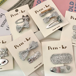 Sparkly silver cat and bow hair clip set on display card for girls sweet hair accessory