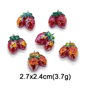 Detailed view of six colorful twin strawberry pendants with metallic gradient finish