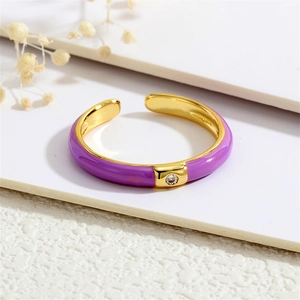 Detailed macro view of 18K gold plated ring with purple enamel coating and tiny zircon
