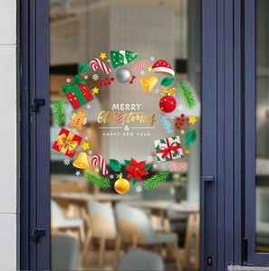Christmas wreath static window sticker with gingerbread man and candy on glass door