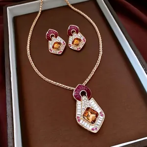 Vintage geometric jewelry set with amber gemstones and crystals in a luxury gift box