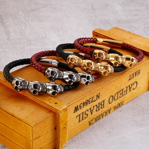 Braided leather skull bracelets in black and red with silver and gold metal charms