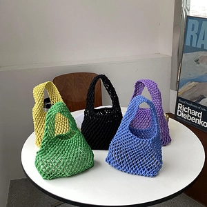 Detail shot of cotton rope woven tote bags in green, yellow, black, blue and purple
