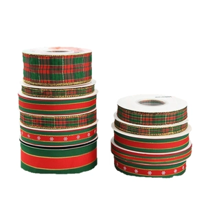 Festive Christmas plaid and snowflake ribbons in red, green, and gold for gift wrapping