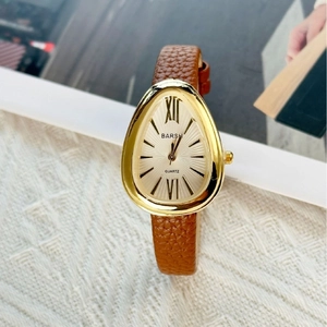 Vintage water drop shaped quartz watch with gold snake head case and brown leather strap