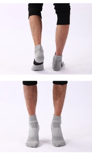 Detail view of thickened sports socks with gray breathable fabric and arched support design