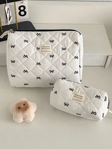 Quilted white cosmetic bag set with black bow patterns and star plush pendant