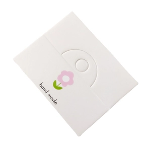White card holder for hair accessories featuring pink flowers and Hand Made print