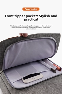 Detailed view of the front zipper pocket with interior slots for a phone and two pens
