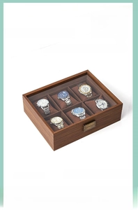 Detail of 6-slot wooden watch box with walnut finish, clear glass top and metal clasp