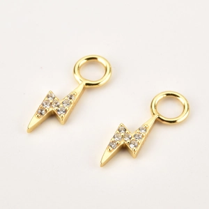 Elegant gold lightning bolt drop earrings with sparkling zircon stones on white background