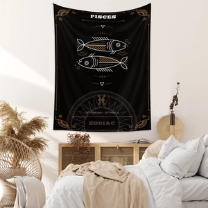 Detail of black and gold Pisces zodiac tapestry with star map on white bedroom wall