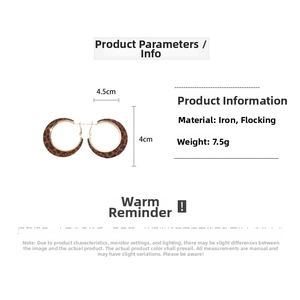 Detail view of large leopard print flocked hoop earrings with 4.5cm diameter measurements