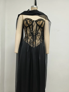 Detail of black lace corset bodice with boning and sweetheart neckline on evening gown