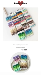 Detailed view of colorful satin scrunchies sets on display cards in multiple shades