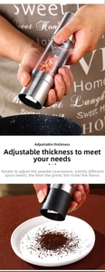 Close-up of dual stainless steel manual salt and pepper grinder with adjustable coarseness