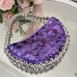 Sparkling purple sequin crescent shoulder bag with white rhinestone trim for evening gala