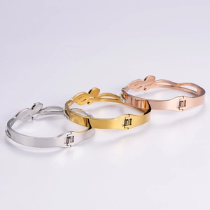 Three-color snake-inspired titanium steel bracelets with pavé accents in a set