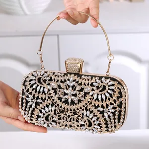 Luxury black rhinestone dinner clutch with golden frame and metal handle for evening parties