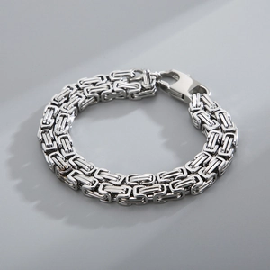 Close-up of silver stainless steel Byzantine chain bracelet with lobster clasp