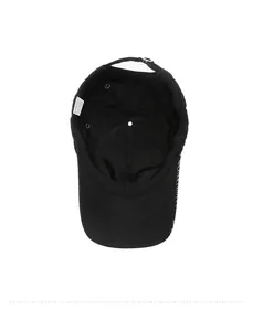 Detail showing the inner lining of a black quick-dry cap with stitching and metal buckle