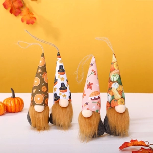 Set of four autumn gnomes with maple leaves and pumpkin hats for Thanksgiving decor