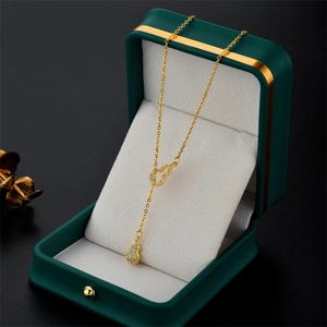 Elegant gold titanium necklace with double gourd crystal pendant in a luxury gift box