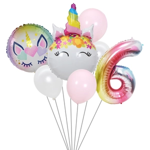 Detail of a unicorn and gradient number 6 balloon set for 6th birthday decorations