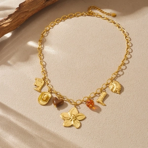 Vintage gold-plated necklace featuring floral, cowboy boot, hat, and heart charms