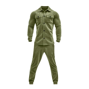 Detail of olive green suede men's two-piece set featuring button-up jacket and trousers
